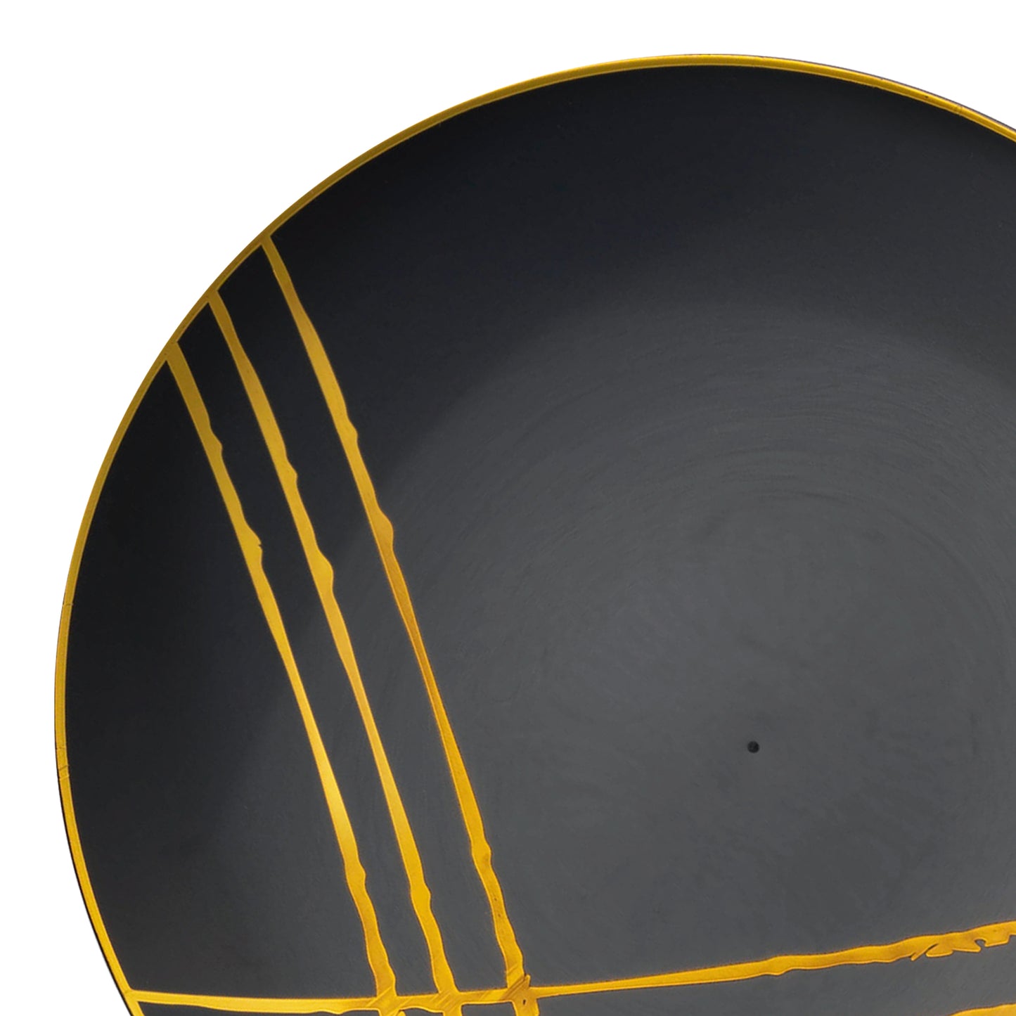 A close-up of a stylish Black with Gold Brushstroke Round Disposable Plastic Salad Plate (7.5") features minimalist gold line decorations along one edge. The lines intersect partially on the bottom-left corner, creating a modern and elegant design. The plate's rim is also accented with a thin gold border, making it an exquisite choice for any setting.
