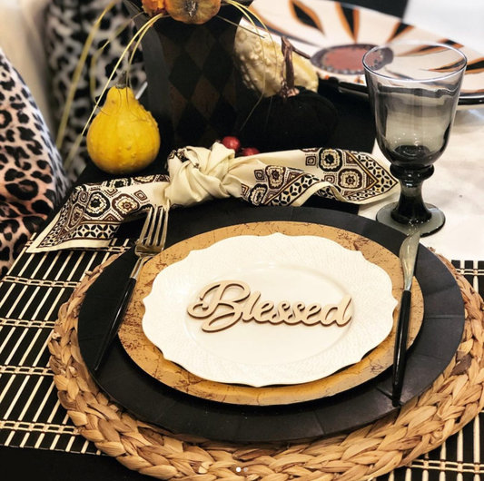 A Thanksgiving table setting featuring fancy disposable tableware, elegantly arranged for a festive meal.