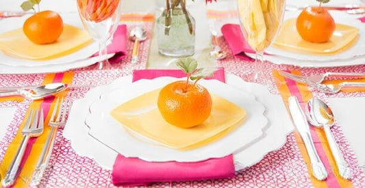 Vibrant summer tablescape featuring colorful disposable dinnerware.