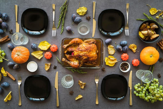 A Thanksgiving dinner spread with a succulent roasted turkey, seasonal vegetables, and a variety of fresh fruits.