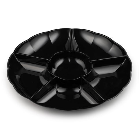 The Black Big 6-Partition Round Plastic Tray features a central circular compartment and six surrounding wedge-shaped compartments, all crafted from durable black plastic. With its slight scalloped edge, it is perfect for organizing and displaying different snack items, making it an ideal reusable tray for any gathering.