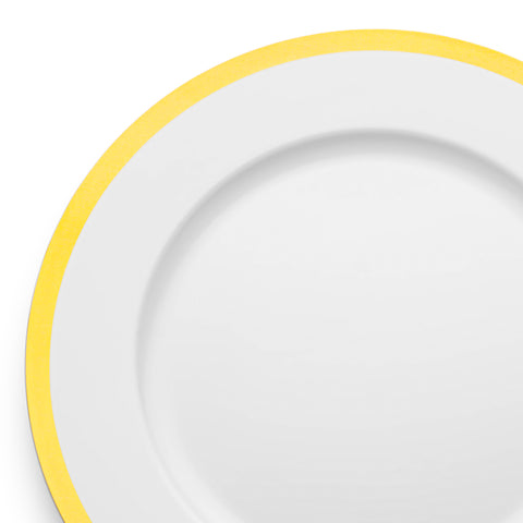 A close-up of a White with Gold Rim Round Plastic Charger Plate (13