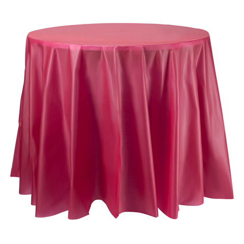 A round table adorned with a lustrous, deep pink covering. The fabric cascades gracefully over the sides, forming gentle folds and a subtle sheen that mirrors the look of Burgundy Round Plastic Tablecloths (84