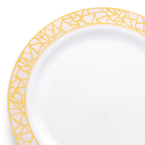 A white salad plate showcasing an intricate gold and pink geometric mosaic pattern around the rim. The design features irregular, sharp-edged shapes that form a striking border, imparting a luxurious and elegant look to the plate. The BPA-free plastic plate is highlighted in close-up detail.