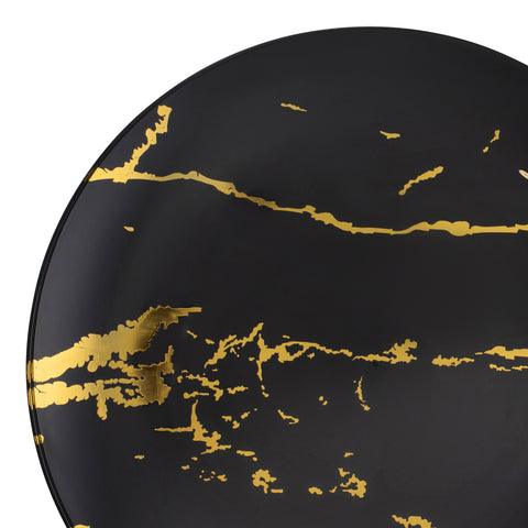 A close-up of one of the Black with Gold Stroke Round Plastic Disposable Dinner Plates (10.25