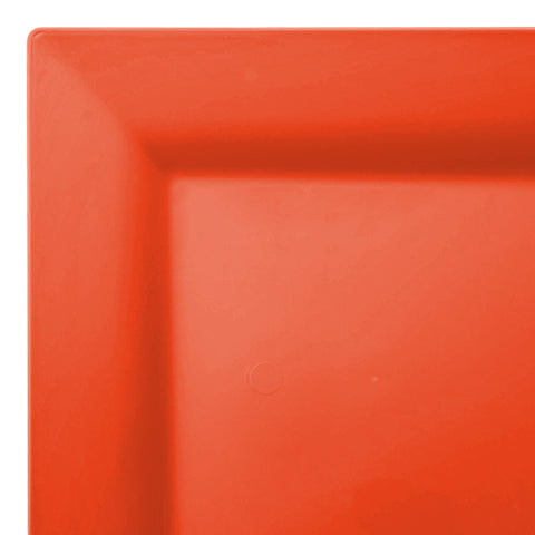 A close-up of a bright orange square plate with a smooth and glossy surface. The Tropical Coral Square Disposable Plastic Cake Plate (6.5