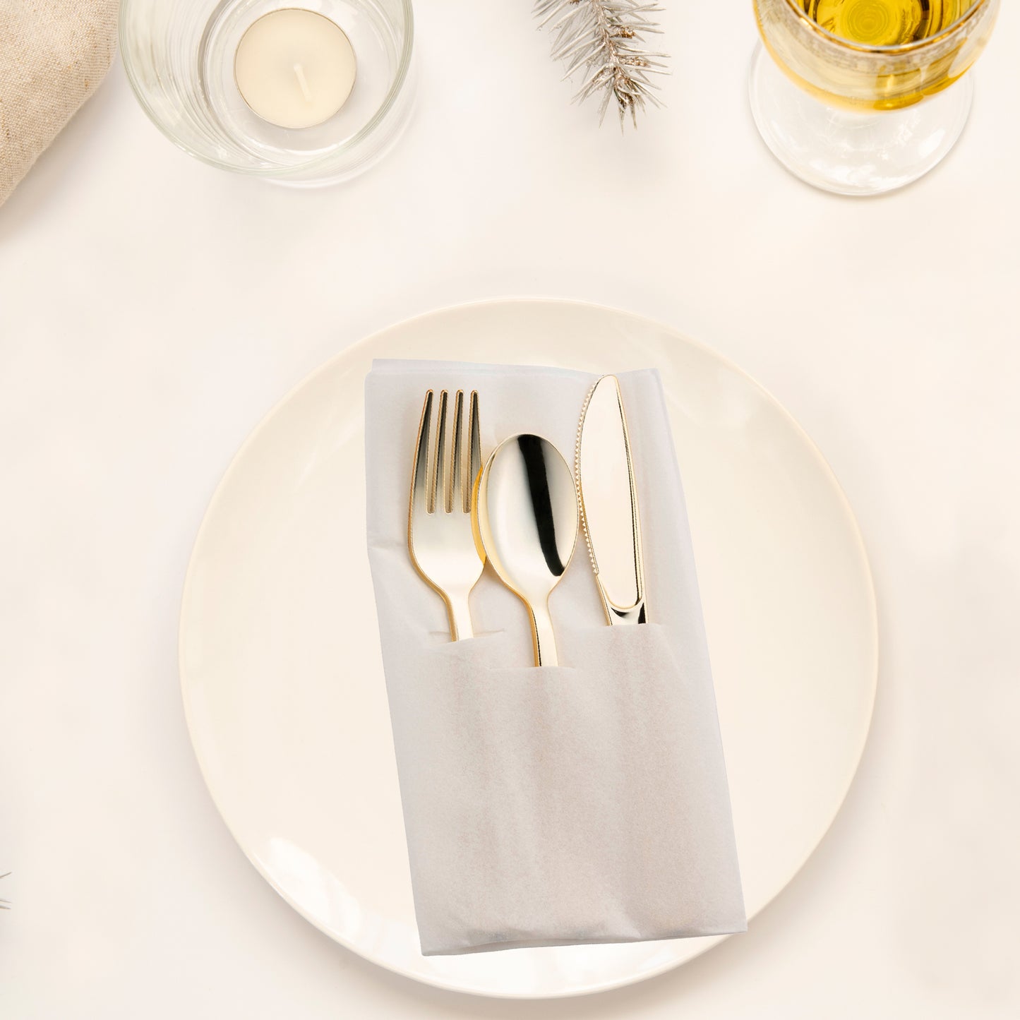 Gold Disposable Plastic Cutlery in White Pocket Napkin Set - 7 Napkins, 7 Forks, 7 Knives, and 7 Spoons